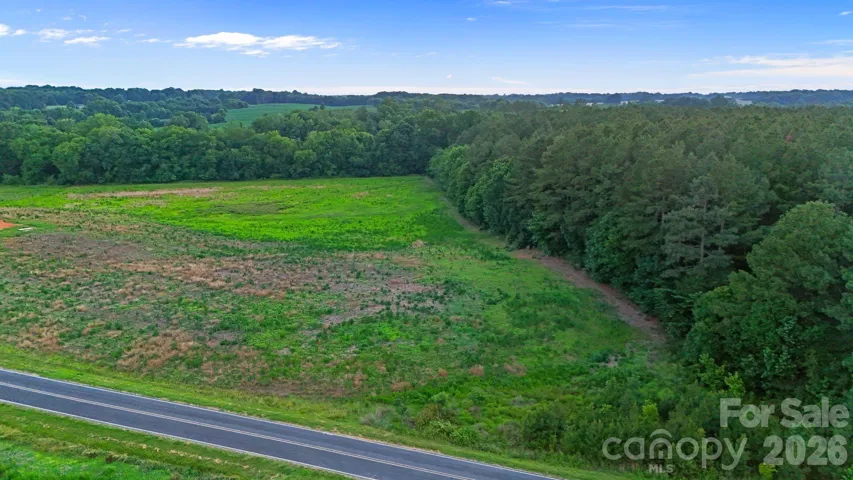 13+ Acre homestead with paved road frontage and electricity