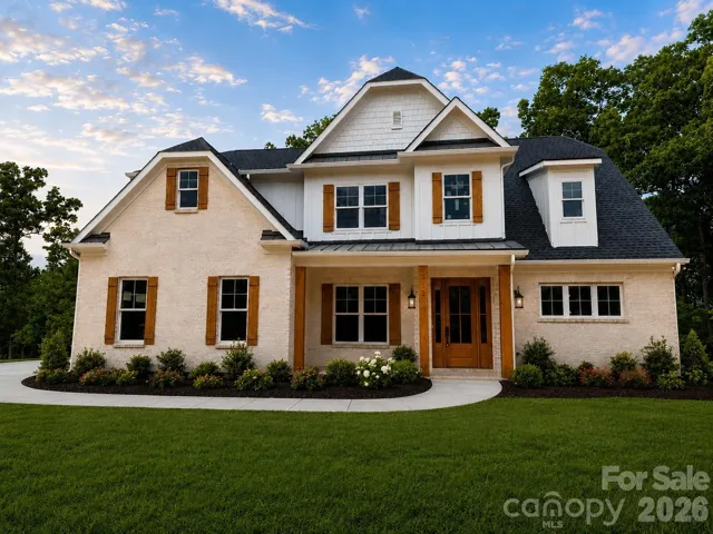 Custom-built brick home situated on a sprawling 2.14-acre lot. Grass will be installed prior to closing.