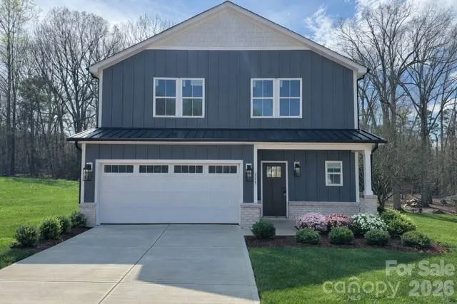Landscape is virtually staged - Actual photo of constructed house