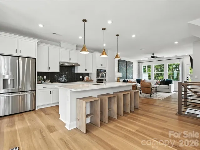 Gourmet kitchen with a counter-depth French-door refrigerator
