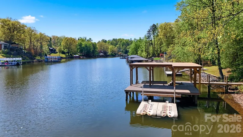 A Lakefront Dream with an irreplaceable shoreline and 2-story dock with boat lift and jet ski dock.