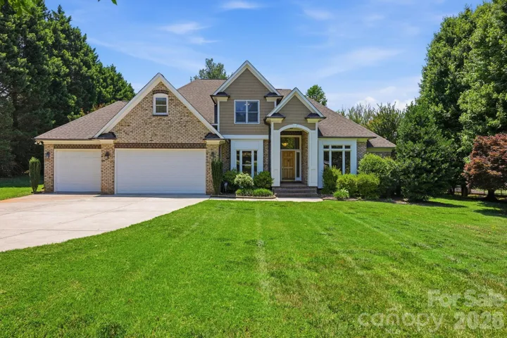 Beautiful, meticulously maintained home on the 13th hole of Lake Norman Golf Club with lake access!