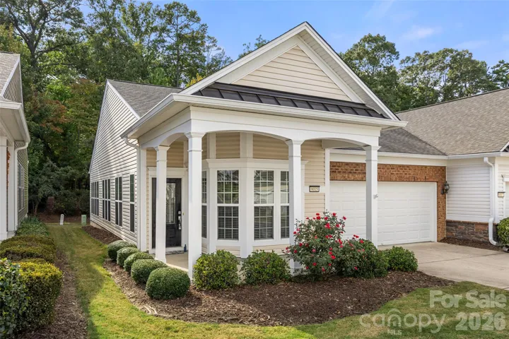 Covered front porch & brick accents!