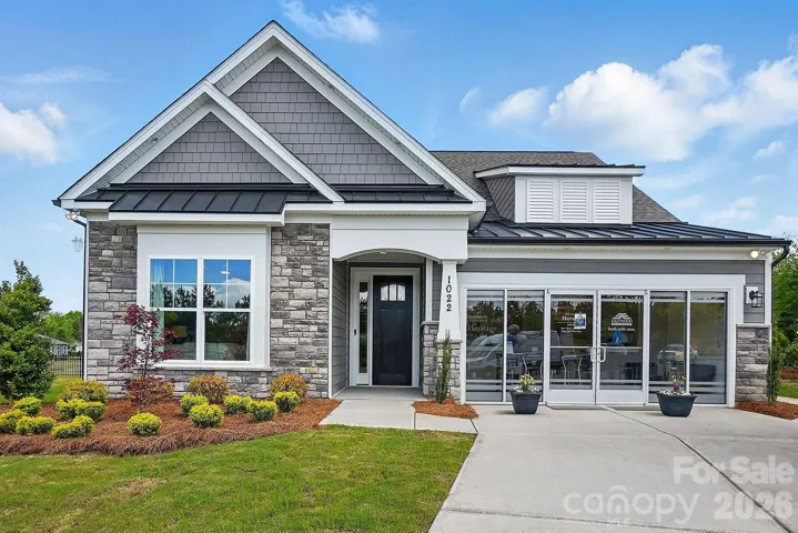 Model Home at Lot 303 features a Wescott D floorplan