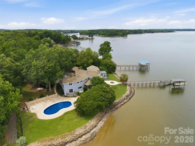 Located on a hard to find level lot with main channel views