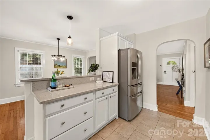 Kitchen with brand new quartz countertops and stainless steel appliances