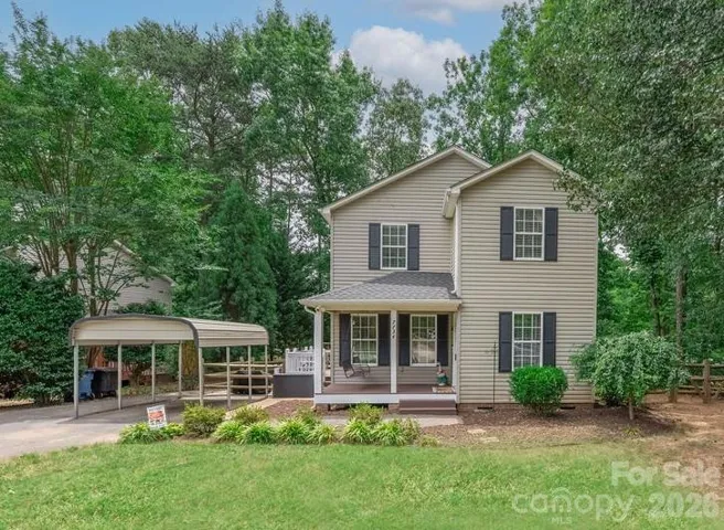 AMAZING 2.5% Assumable Loan Opportunity on this Charming 2-story home nestled in mature trees, adding privacy!!
