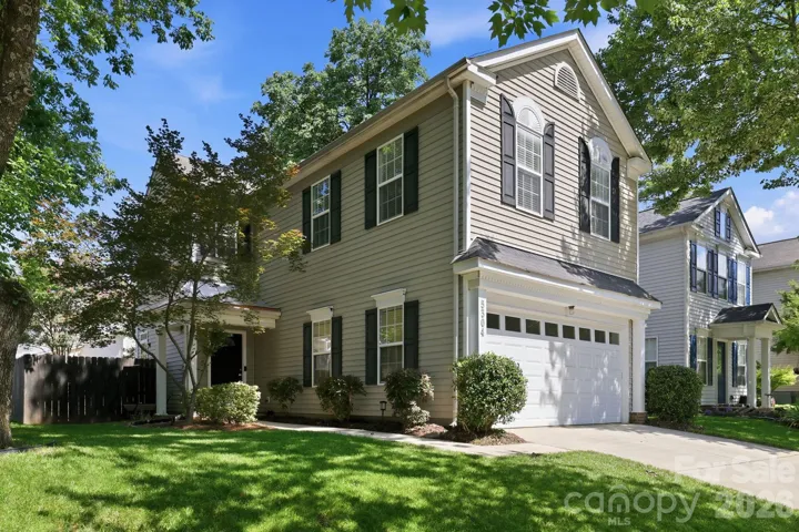 Beautifully maintained home on a desirable corner homesite with mature trees and exceptional curb appeal.