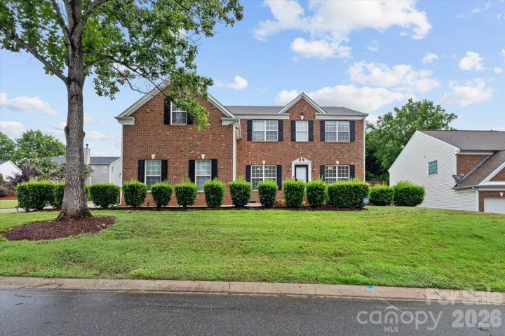 Beautiful landscaped front yard/corner lot.