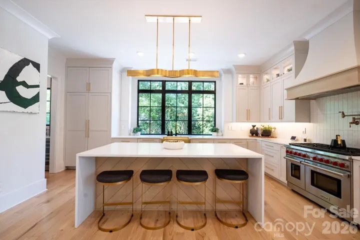 Chef's Kitchen & Island with Paneled Refrigerator