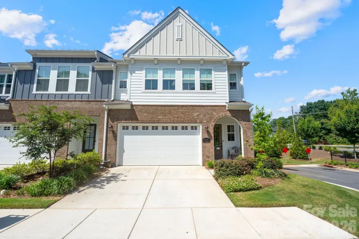 — brick & board-and-batten exterior, oversized 2-car garage & extended driveway on a private corner homesite minutes from SouthPark & Ballantyne.