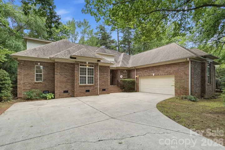 Welcome to this custom ranch+ on the golf course at 10312 Club Trophy Lane in Olde Sycamore.