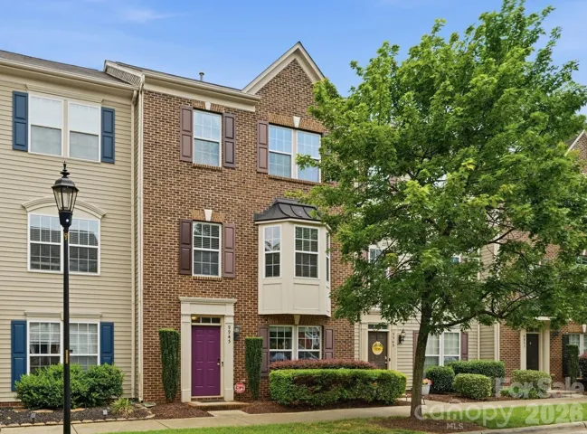 9945 Kings Parade Blvd. Brick front with Bay window.