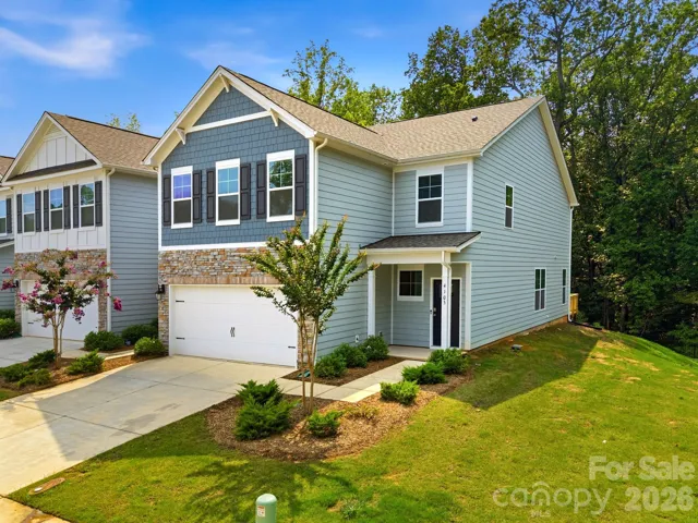 Better-than-new end-unit with wooded views and curb appeal.