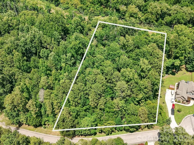 Surrounded by mature trees, this spacious .93-acre lot in The Preserve at Cold Water Creek provides a rare opportunity to create your ideal home with the privacy of a wooded setting just minutes from the heart of Concord.