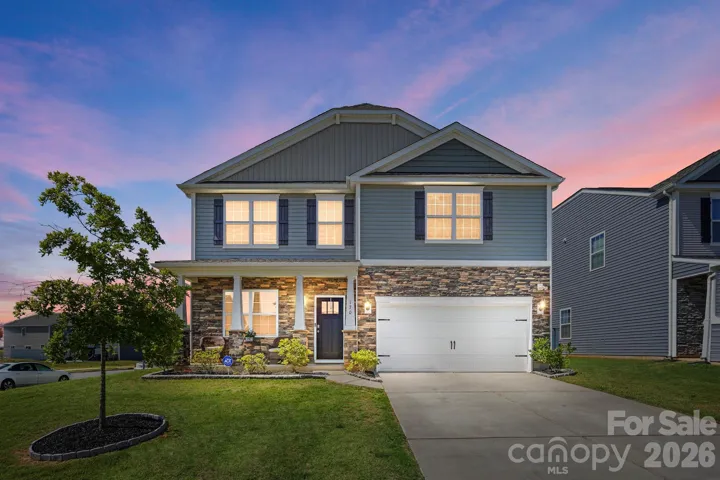 Welcome home to timeless curb appeal on a desirable end lot with beautiful stone accents.