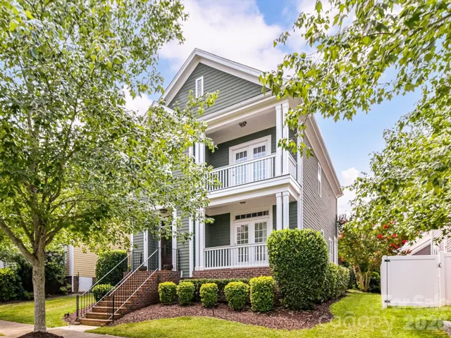 Classic Southern charm shines from this beautifully landscaped Monteith Park home, where dual covered front porches create an inviting first impression in one of Huntersville's most sought-after communities.