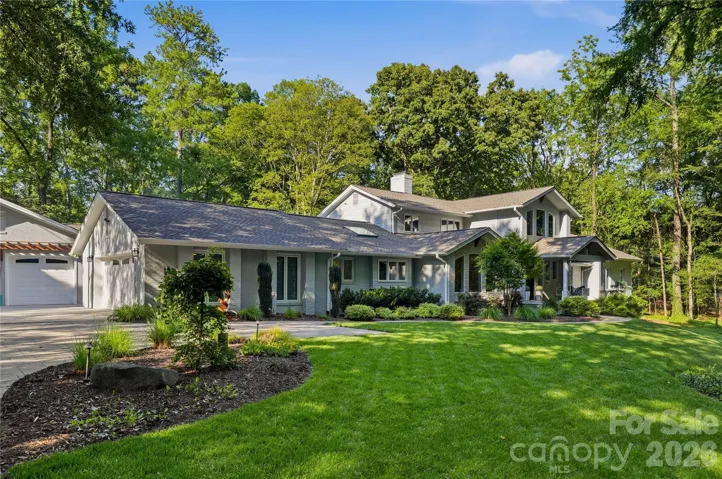 Set on 1.45 private acres in coveted Pellyn Wood, this striking luxury residence is surrounded by mature trees, lush landscaping and expansive lawn, creating a rare sense of privacy and tranquility in the heart of Charlotte.