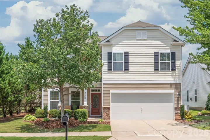 Welcome home to a charming covered front porch, the perfect inviting spot to sip your morning coffee and greet your neighbors.