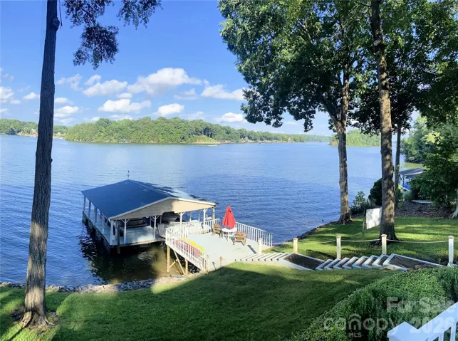 Views, views, views, gently sloped lot on open water.