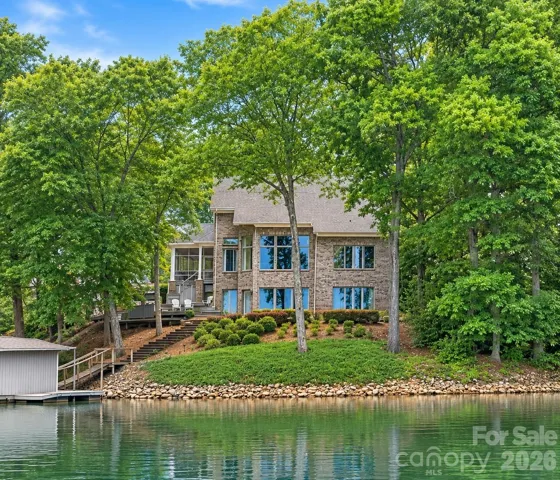 Nestled in a quiet, protected cove with gentle sloped lot.