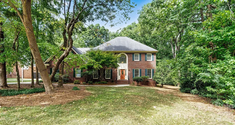 Timeless full-brick home nestled on a nearly half-acre homesite in sought-after Hidden Hills.