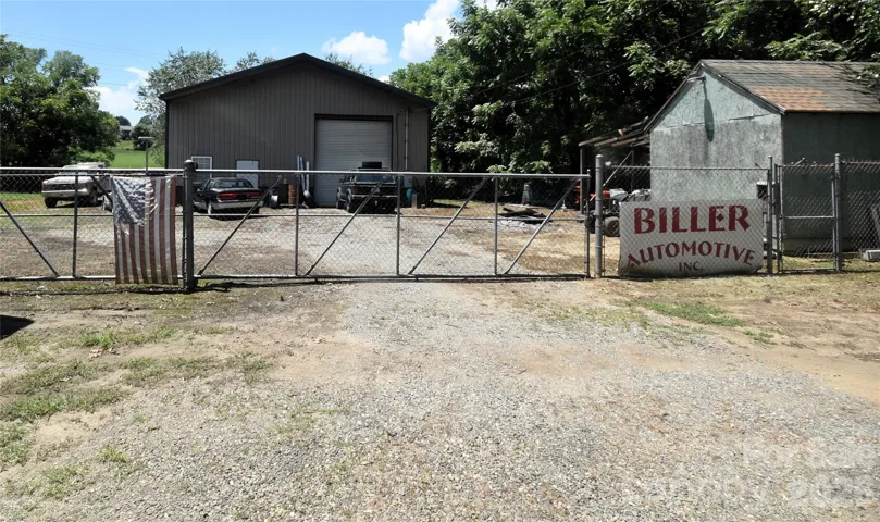 From the main gate to the main building.  All the property is fenced by chain link with gates.