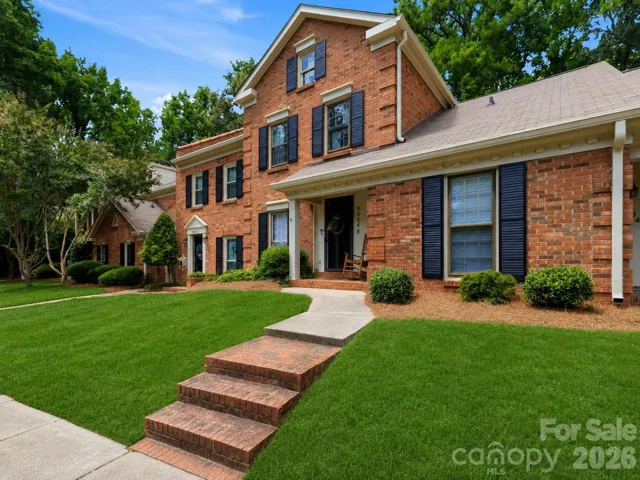 Beautifully updated brick townhome welcomes you with timeless curb appeal!
