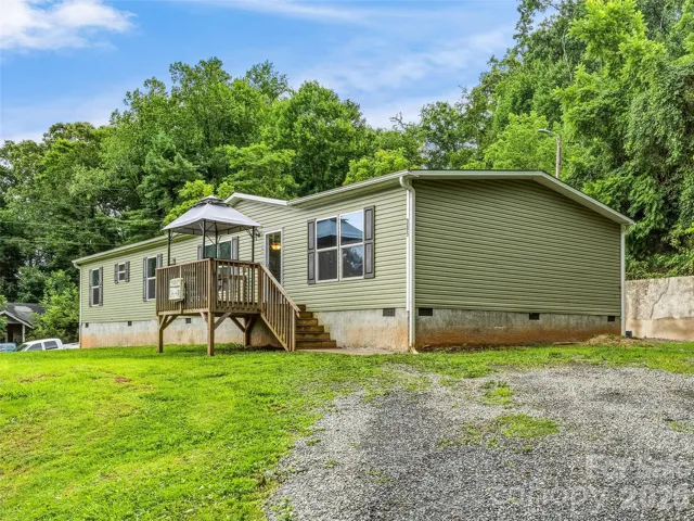 Model year 2020. Permanent Foundation. .46 acres of quiet with a towering legacy tree that shades the front yard. Super retaining wall built and storage unit in place.
