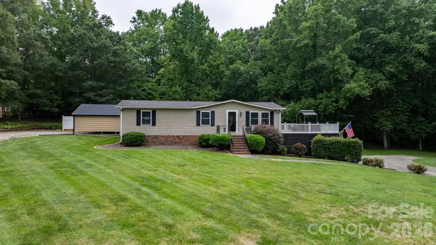 Front of home showing upper and lower driveways