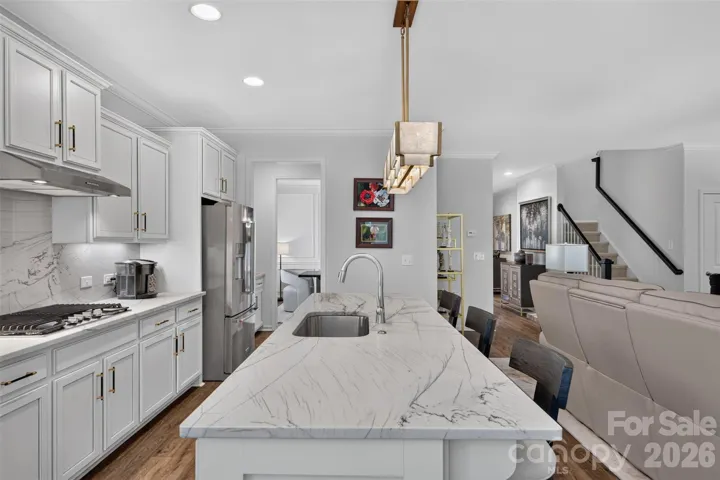 The Remodeled Kitchen boasts stunning hand picked Quartzite countertops and backsplash.