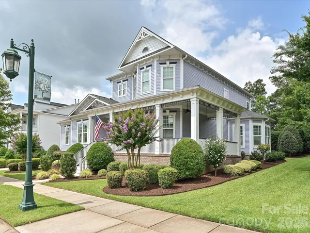 9624 Cotton Stand Rd. with a wrap-around porch overlooking the meticulously maintained lawn.