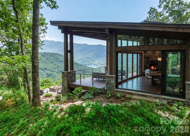 This would be an approved portion o a house located EXACTLY on the house-site as described in listing comments. View angle off deck could be reality if purchased with driveway to top, coming in behind house opposite view side. See Pic 2 & 3...Get it?