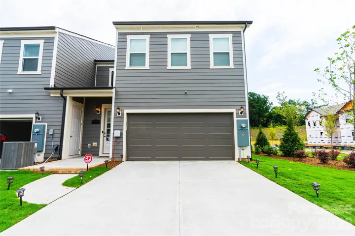 Rear 2-car Garage, Driveway and Entry Door