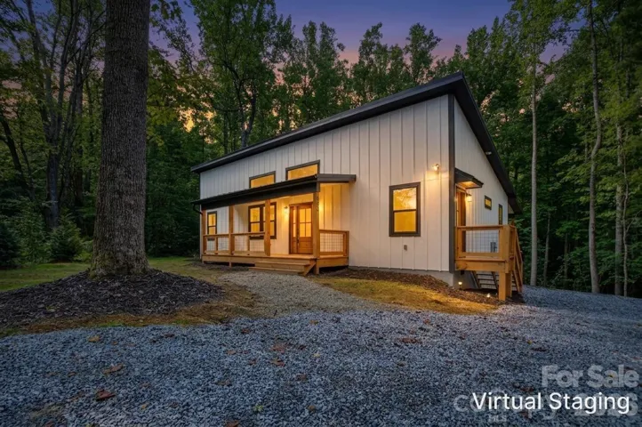 Stunning twilight exterior view of the front elevation.