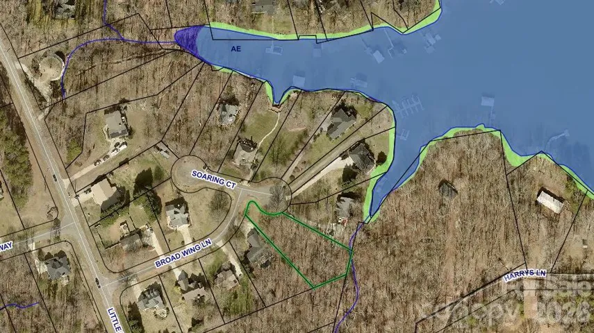 4177 Soaring Ct/Lot 5 outlined in green. Water Access Lot with boat slips is located directly across the cul-de-sac at 4182 Soaring Ct.  See long narrow lot with dock at end containing 8 boat slips.
