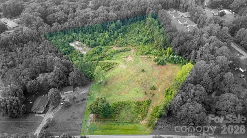 Gorgeous property over 7 acres- mostly flat, almost 3 acres have been cleared