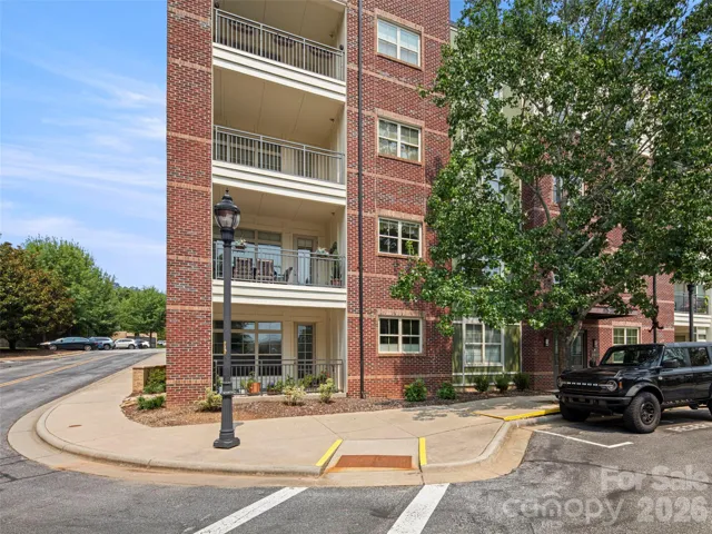 Exterior View. Balcony is the one above the ground level balcony. This also pictures the deeded parking space for #104