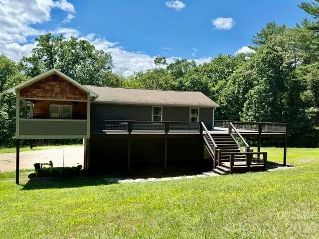 Front View with wrap around deck.