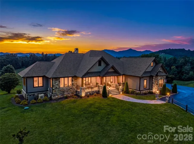 360 Turkey Branch's gracious setting amid rolling pastures, manicured grounds, and layered Western North Carolina mountain views.