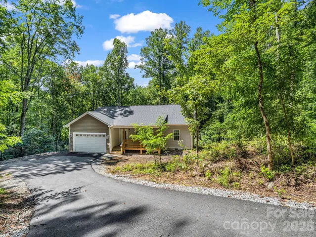 Welcome to 180 Ridgeview Drive.  View from the top of the driveway off Ridgeview Drive down to the house.