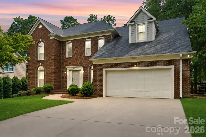 Front exterior at dusk. *Photo has been virtually enhanced.*