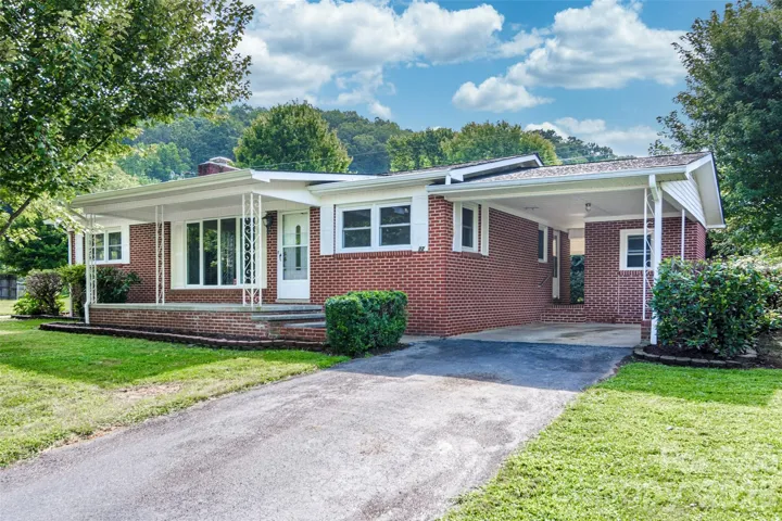 Front with attached carport or entertaining space.