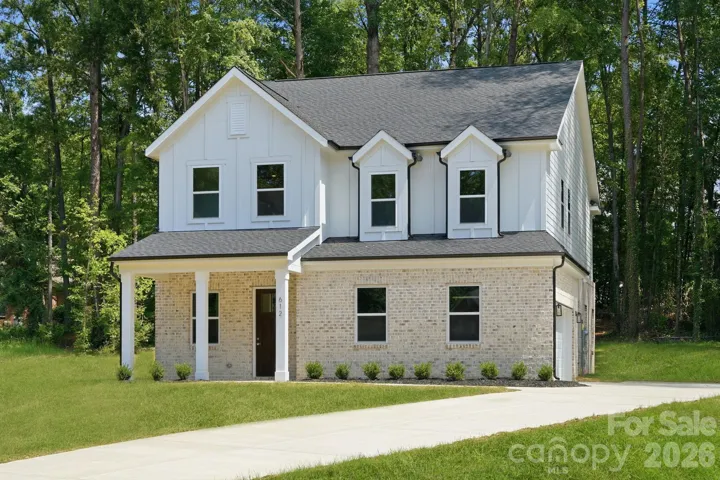 Tucked away on a peaceful, 1-acre cul-de-sac lot in Country Club Hills, this gorgeous new construction home checks all the boxes