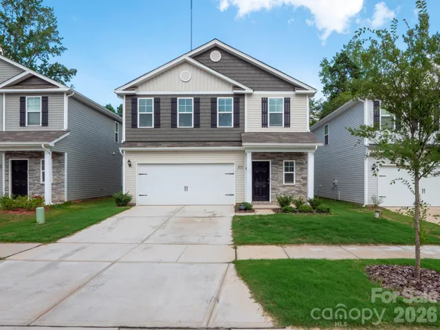 Single family home backing up to the wooded area.