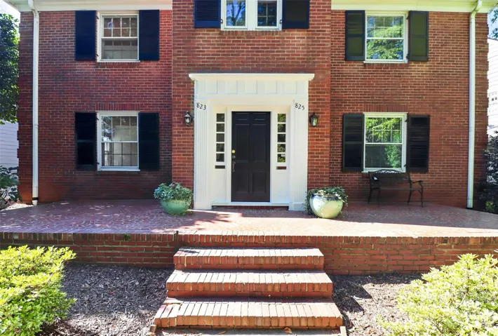 Beautiful front door molding and real shutters