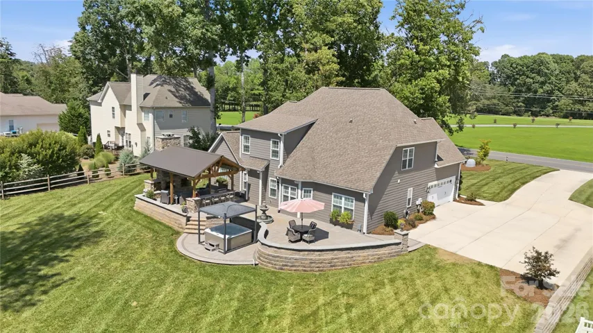 Amazing outdoor living space with covered fireplace & kitchen/hot tub