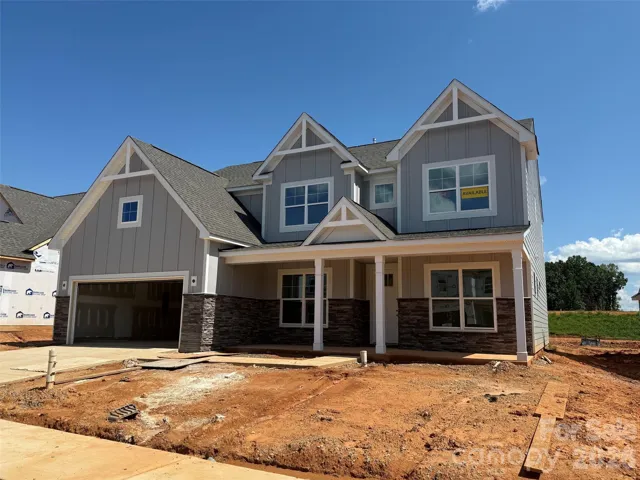 Homesite 111 features a Charleston L floorplan