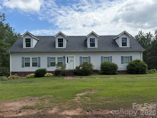 Classic curb appeal, wide open skies, and a place to call your own — 2787 Kiker Rd is ready for you.