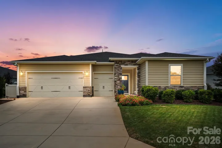 Welcome to 6127 Raven Rock—thoughtfully upgraded one-level living in the resort-style community of Trilogy Lake Norman.
